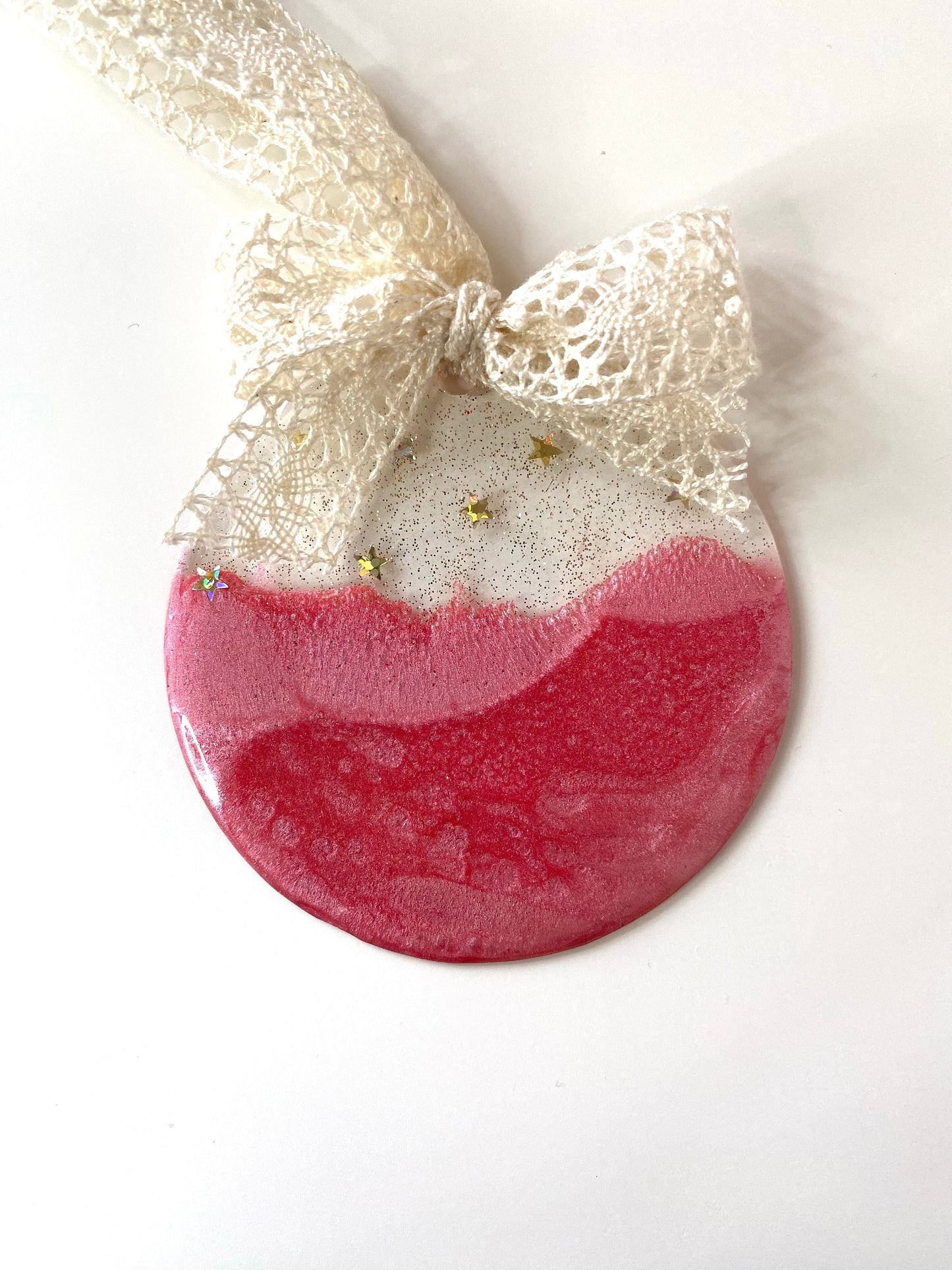 Pink Baby First Christmas resin bauble with glittery gold top and twinkling gold stars, non-personalised, hanging with beige lace ribbon and bow