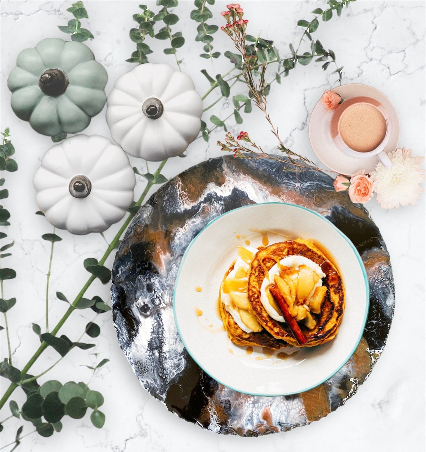 Handmade black and bronze resin tray with slate base, large round coffee table and vanity tray, styled with pumpkins and fall décor, plate with food on tray used as placemat, elegant seasonal home display.