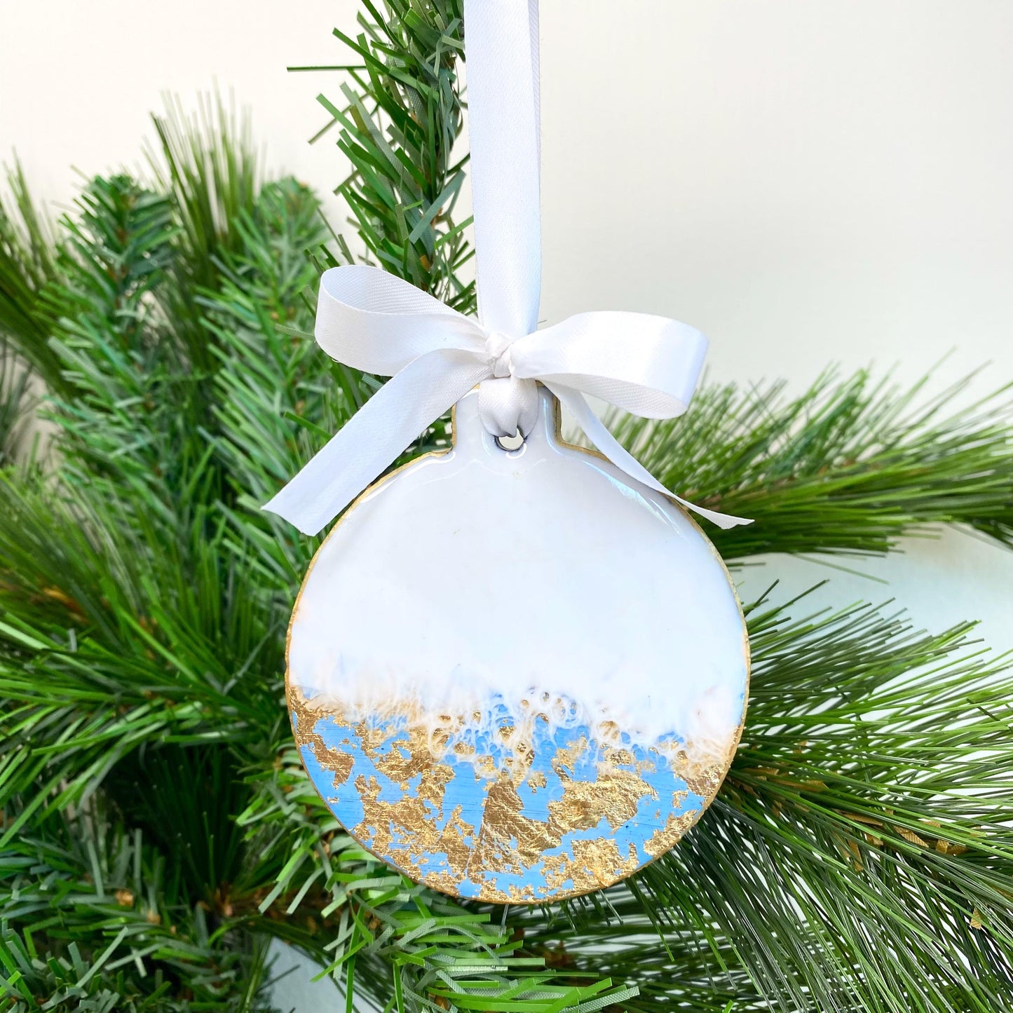 Front close-up of blue slate resin Christmas ornament, non-personalised, showing smooth resin finish, hand-painted gold edges, and white ribbon for hanging