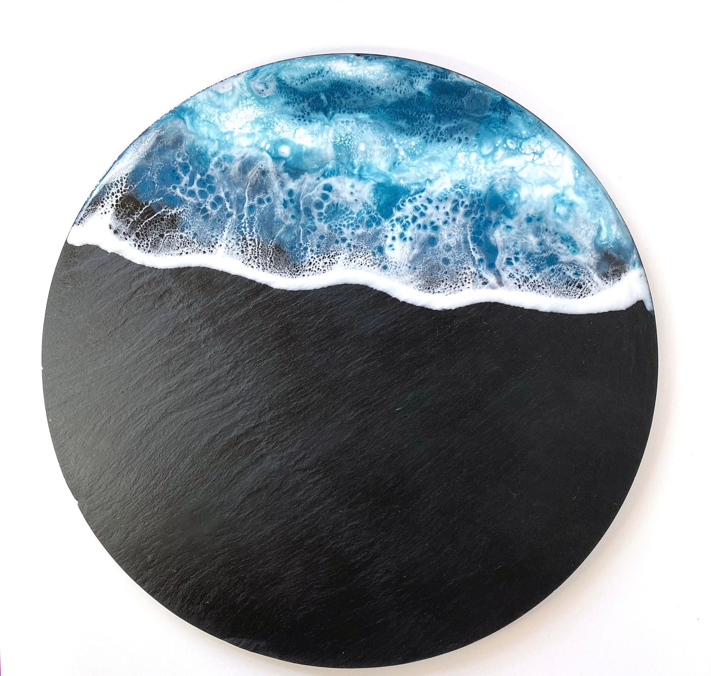 Top-down view of handmade ocean resin charcuterie tray with slate base, empty display showing blue and white resin wave design, coastal-inspired serving and cheese board for home use