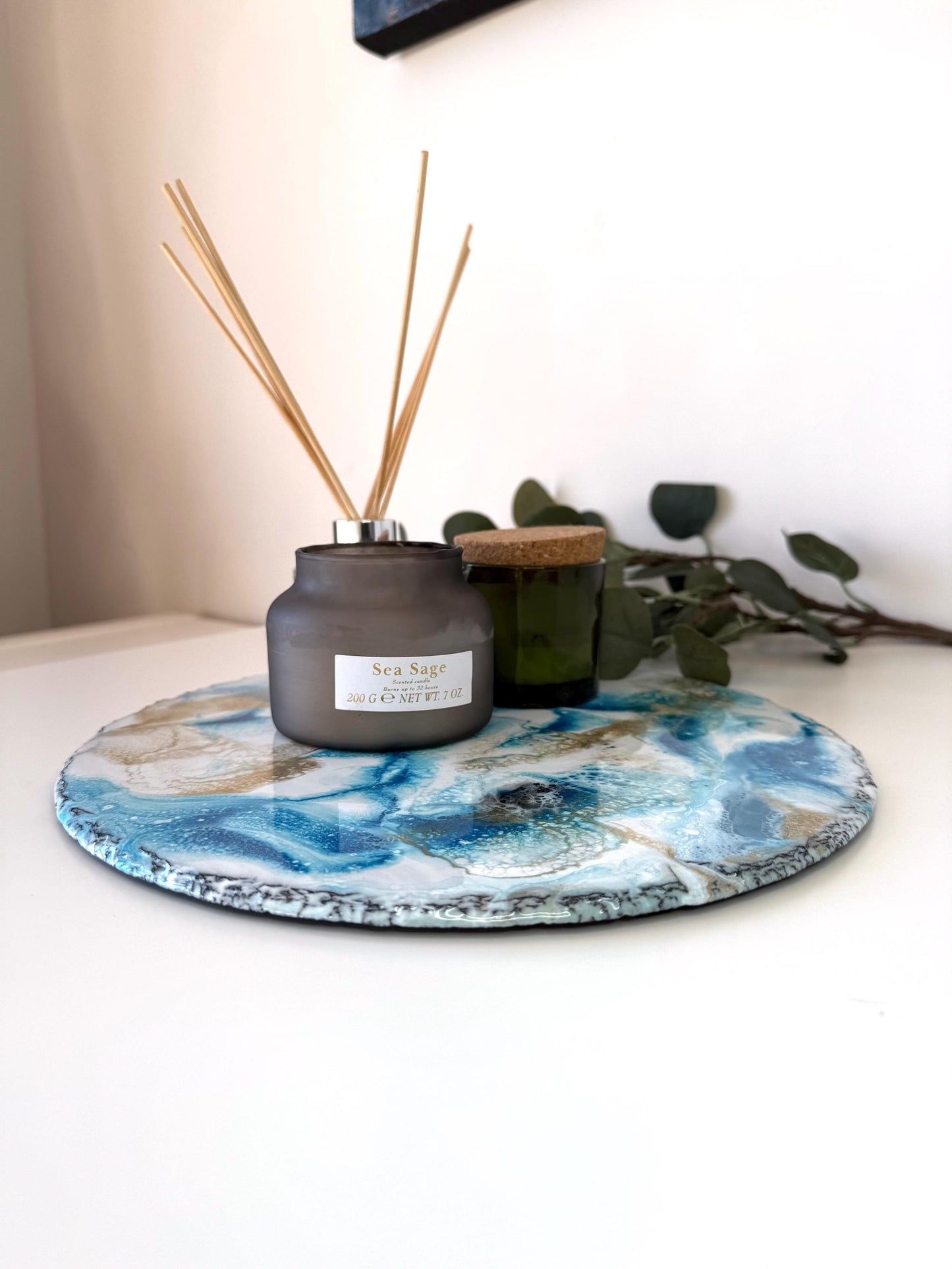 Handmade ocean resin tray with slate base, styled with candles and diffuser, angled view showing full tray, coastal-inspired decorative home decor for serving or displa