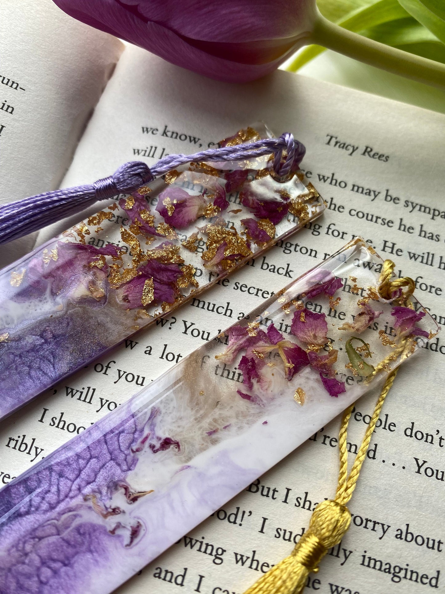Close-up of purple resin bookmark with clear resin showing dried roses and gold leaf, highlighting handmade details and craftsmanship, personalised and non-personalised options