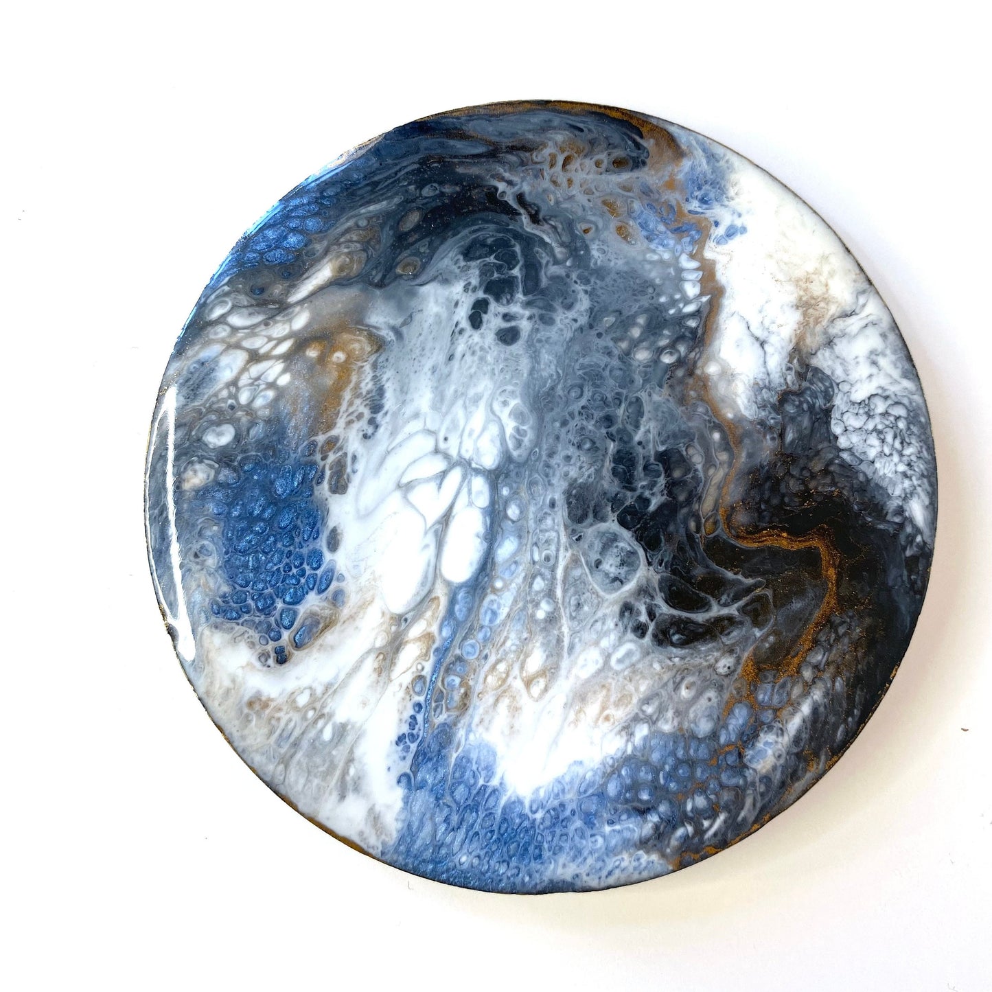 Handmade round slate resin coaster with unique blue, white, black, and gold epoxy design – each coaster is one-of-a-kind and cannot be replicated.