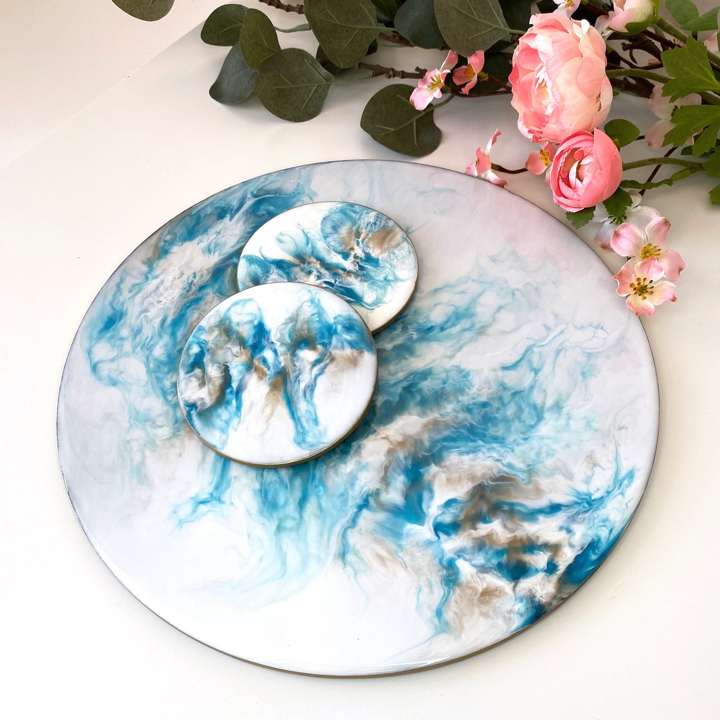 Handmade white and blue resin tray with slate base, large round coffee table and decorative tray, displayed with two matching resin coasters, showing set option for home décor or serving.