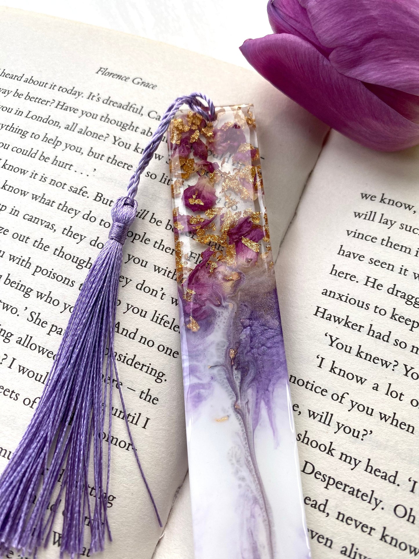 Close-up of white resin bookmark with clear resin showing dried roses and gold leaf, highlighting handmade details and craftsmanship, personalised and non-personalised options