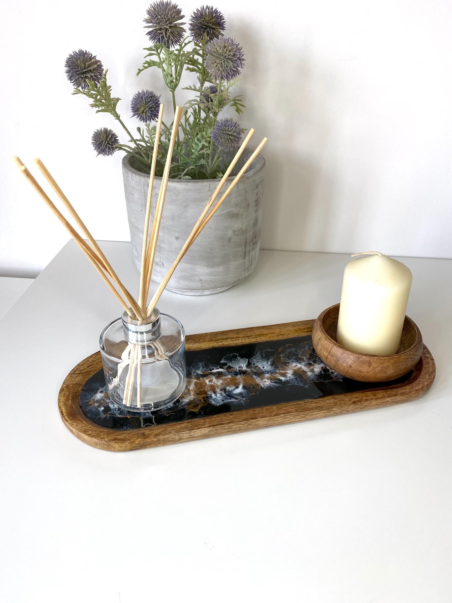 Large handcrafted wooden oval tray with epoxy resin details, featuring a wooden bowl holding a candle and diffuser – stylish home décor for coffee table or vanity display.