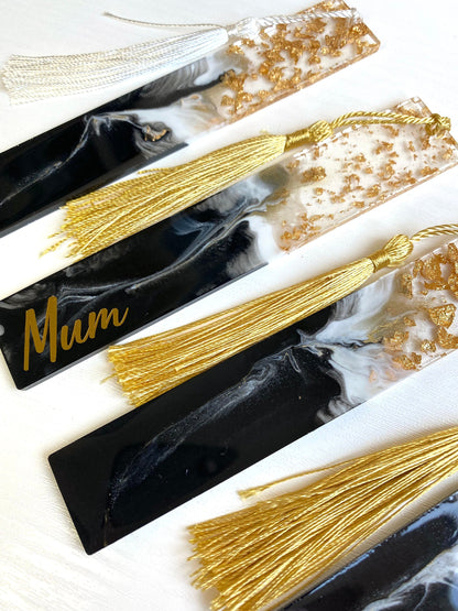 Four black resin bookmarks with gold leaf, two personalised with gold vinyl and two non-personalised, handmade bookmarks for readers or gifts