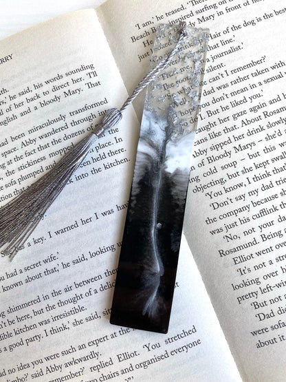 Black & White resin bookmark with silver leaf, non-personalised, placed inside an open book, handmade bookmark for readers or gifts.