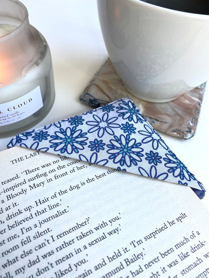 Handmade fabric corner bookmark in Daisy Print design, placed on a book page – perfect gift for book lovers, teachers, or readers.