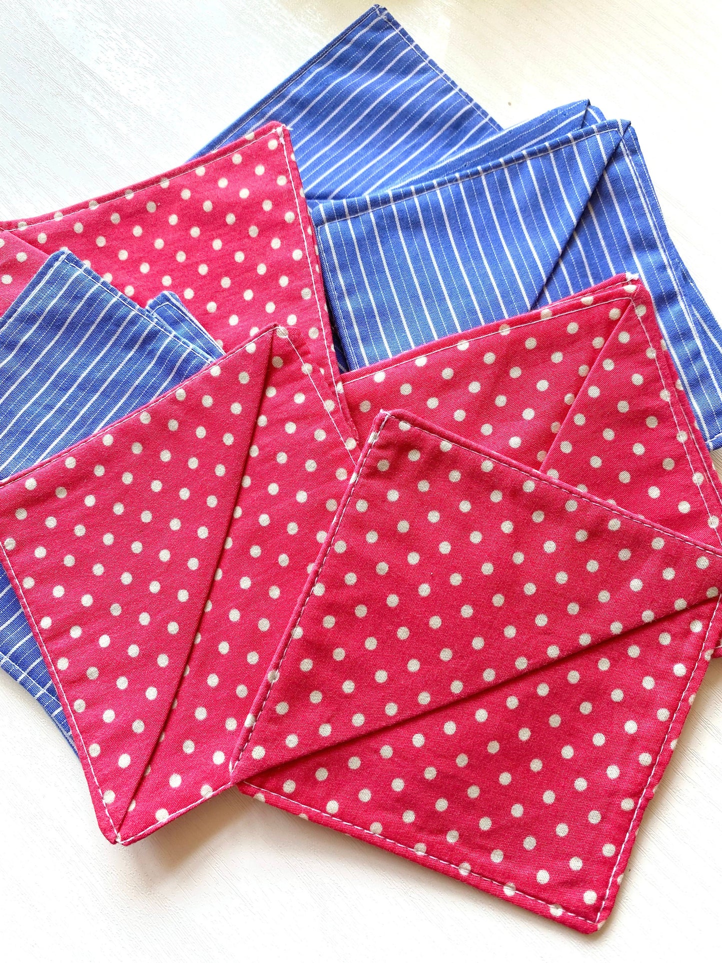 Multiple handmade fabric corner bookmarks in Pink Polka Dots and Blue Stripes designs, displayed together – perfect personalised gifts for book lovers and teachers.