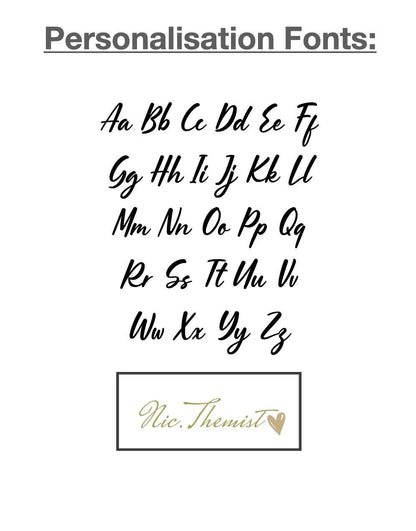Gold vinyl lettering font used for personalising resin Christmas ornaments, showing style for names and custom messages.