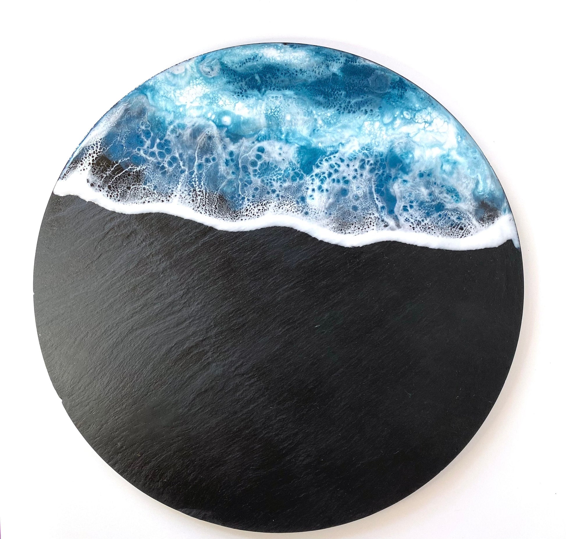 Top-down view of handmade ocean resin charcuterie tray with slate base, empty display showing blue and white resin wave design, coastal-inspired serving and cheese board for home use