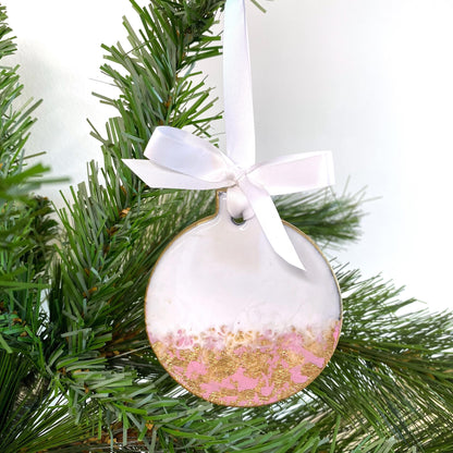 Close-up of pink slate resin Baby’s First Christmas ornament, non-personalised, showing smooth resin finish, hand-painted gold edges, and white ribbon for hanging.