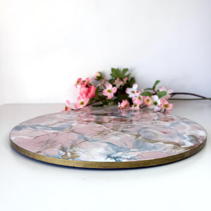 Pink and gold marble-style resin tray with slate base, showing height and hand-painted gold edges, round centrepiece, elegant handmade decorative tray for home or serving