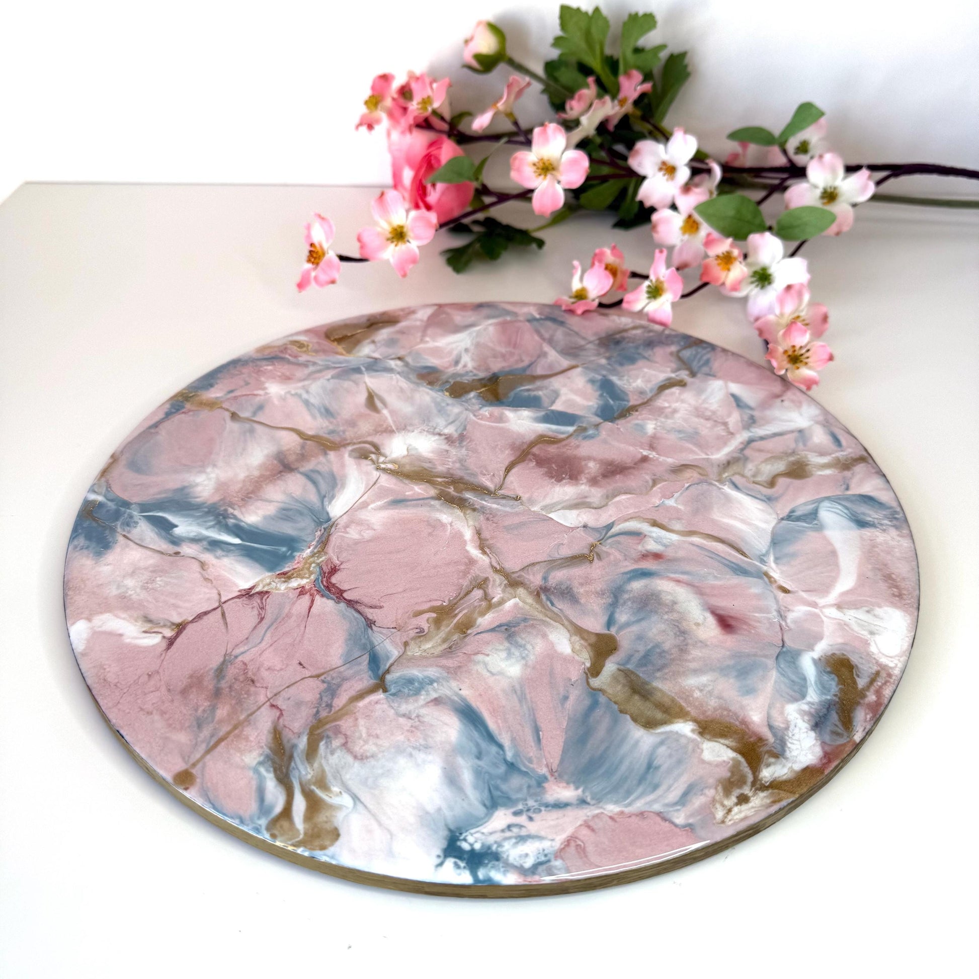 Pink and gold marble-style resin tray with slate base, round centrepiece, plain display on surface, showcasing elegant handmade decorative tray for home or serving