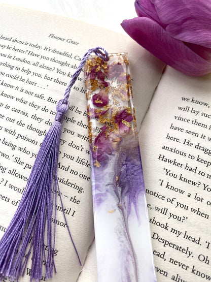 Close-up of white resin bookmark with clear resin showing dried roses and gold leaf, highlighting handmade details and craftsmanship, personalised and non-personalised options